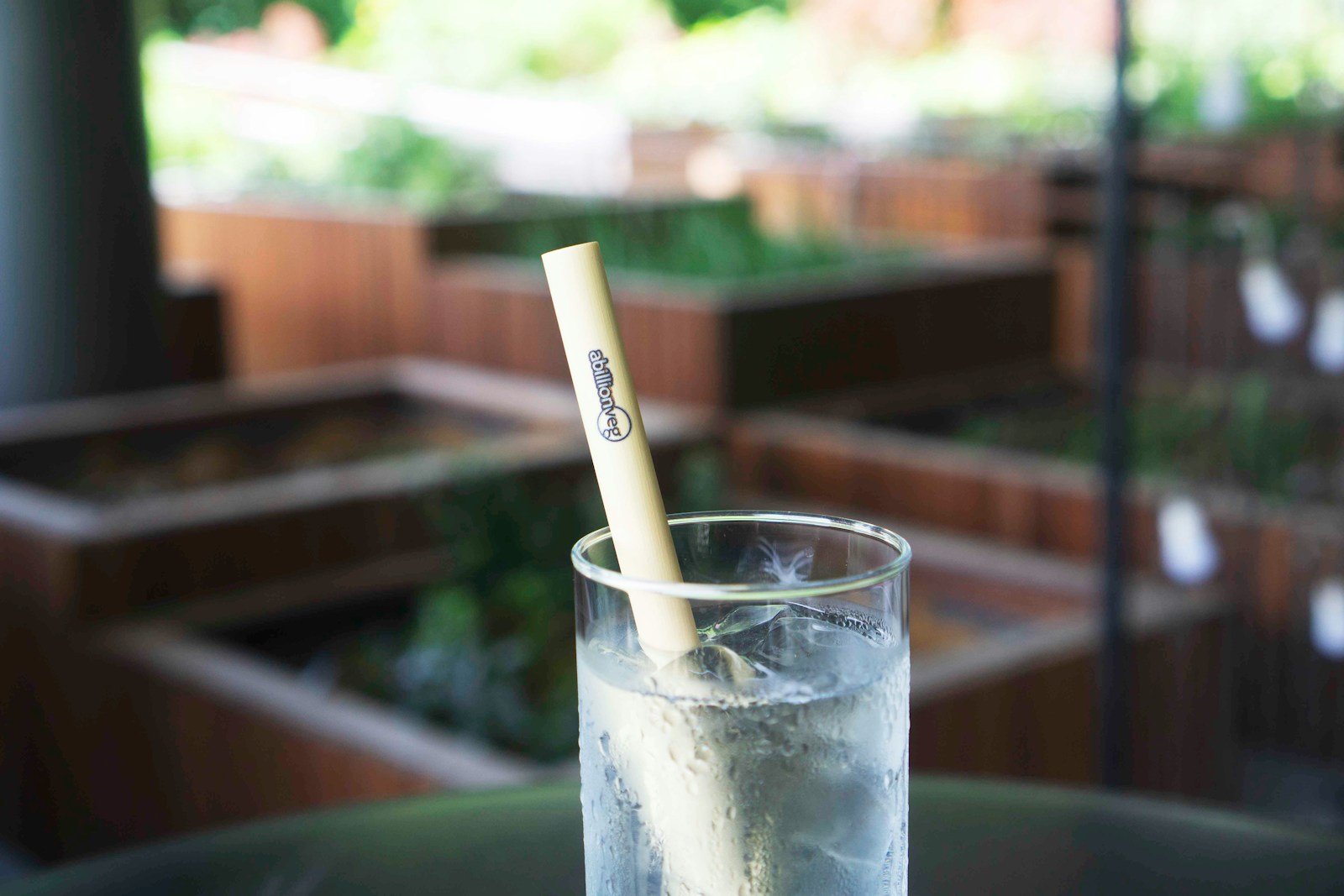 clear drinking glass with white straw